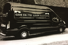 UHM Basements branded van parked outside a London property
